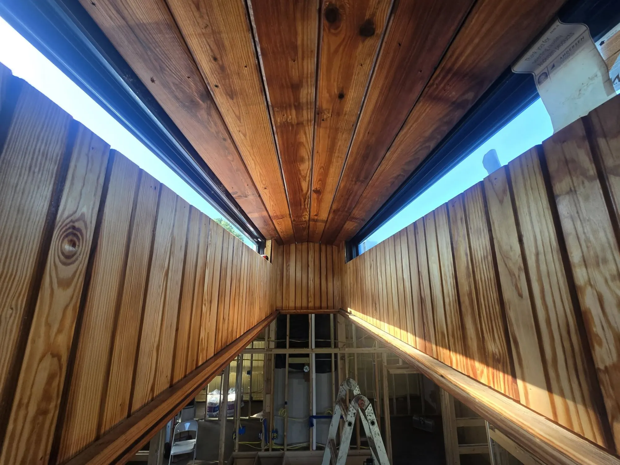 Custom tongue-and-groove wood ceiling under construction