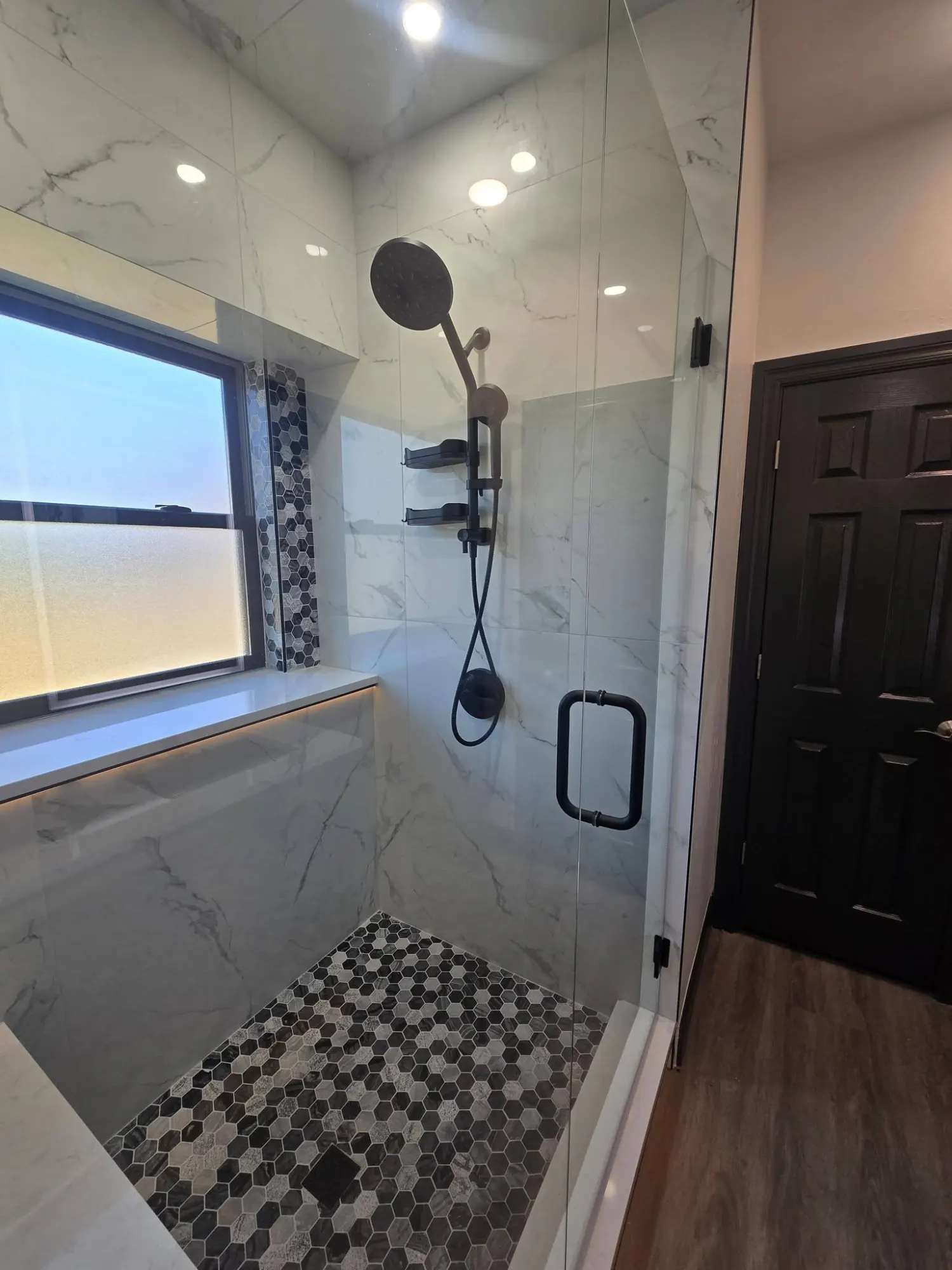 Glass-enclosed walk-in shower in an Edmond bathroom renovation